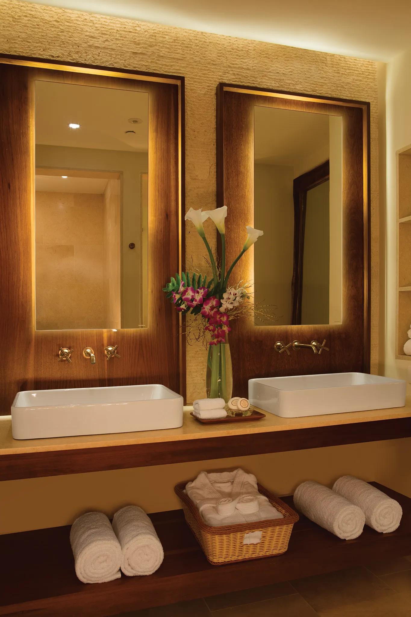Preferred Club Junior Suite Ocean View bathroom with dual vessel sinks, illuminated mirrors, and upscale spa-inspired design at Secrets Cap Cana Resort & Spa.