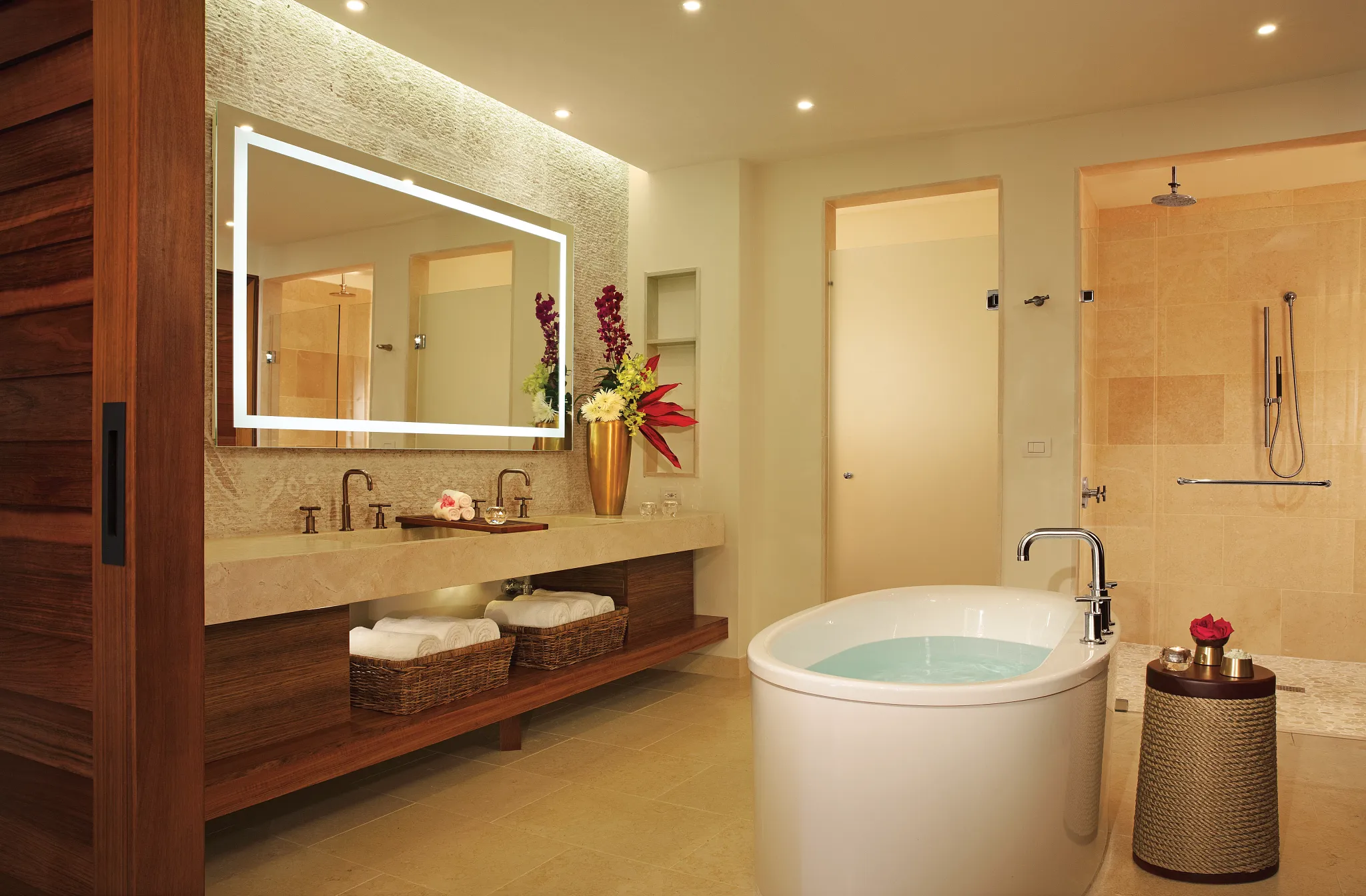 Preferred Club Master Suite Ocean Front bathroom with freestanding soaking tub, double vanity, illuminated mirror, and walk-in rain shower.