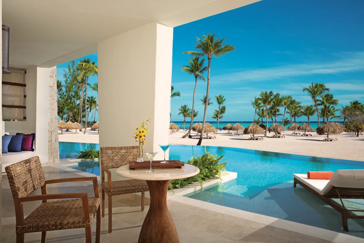 Private furnished terrace with swim-out pool access and panoramic ocean views from the Preferred Club Master Suite.