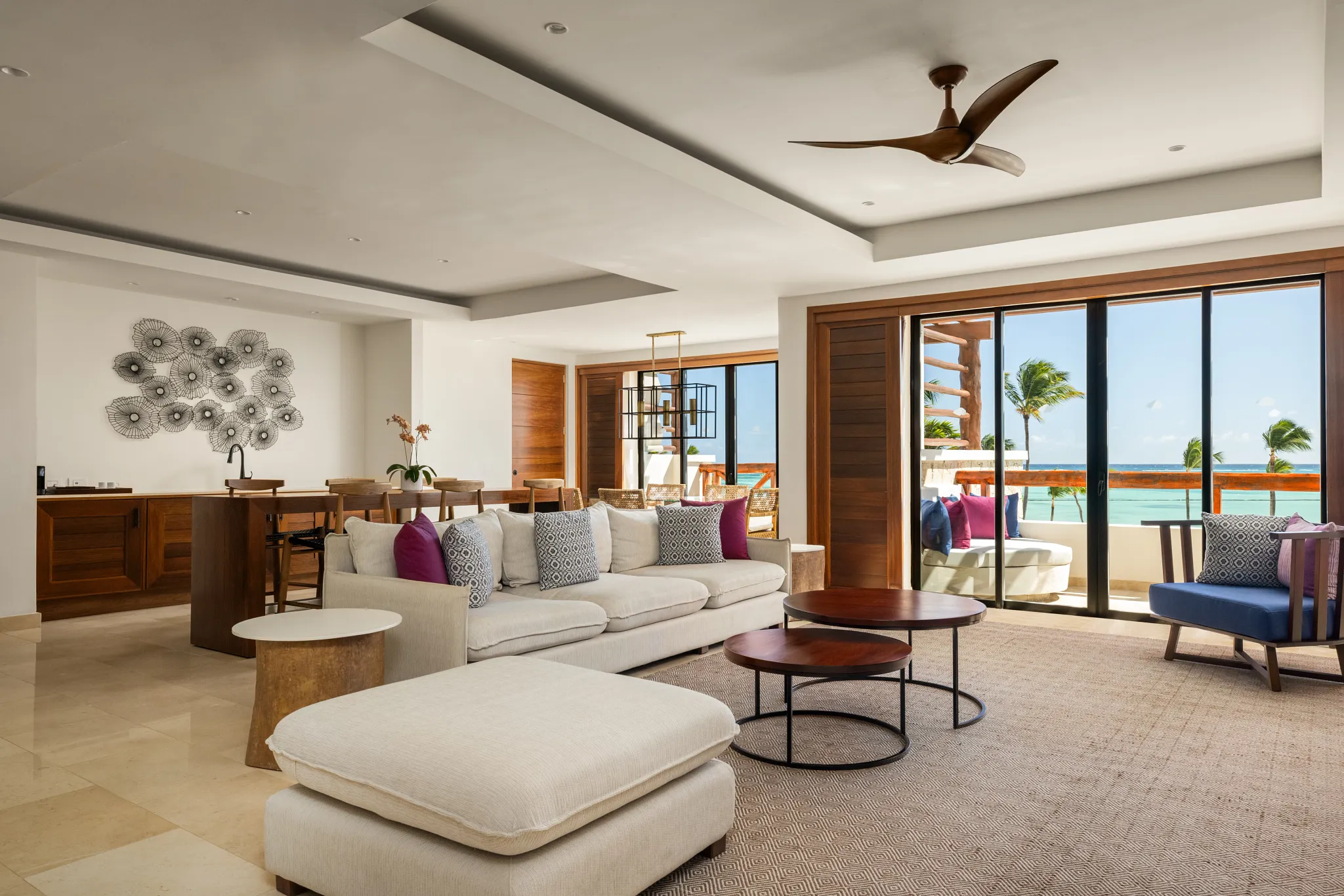 Preferred Club Presidential Suite living room with oceanfront balcony and spacious seating area at Secrets Cap Cana.