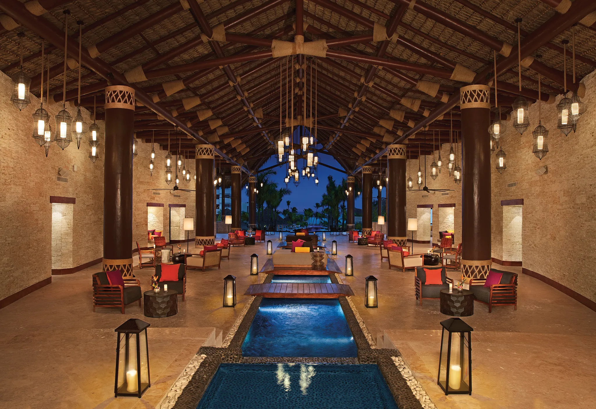 Grand open-air lobby with elegant Caribbean-inspired architecture at Secrets Cap Cana Resort & Spa.